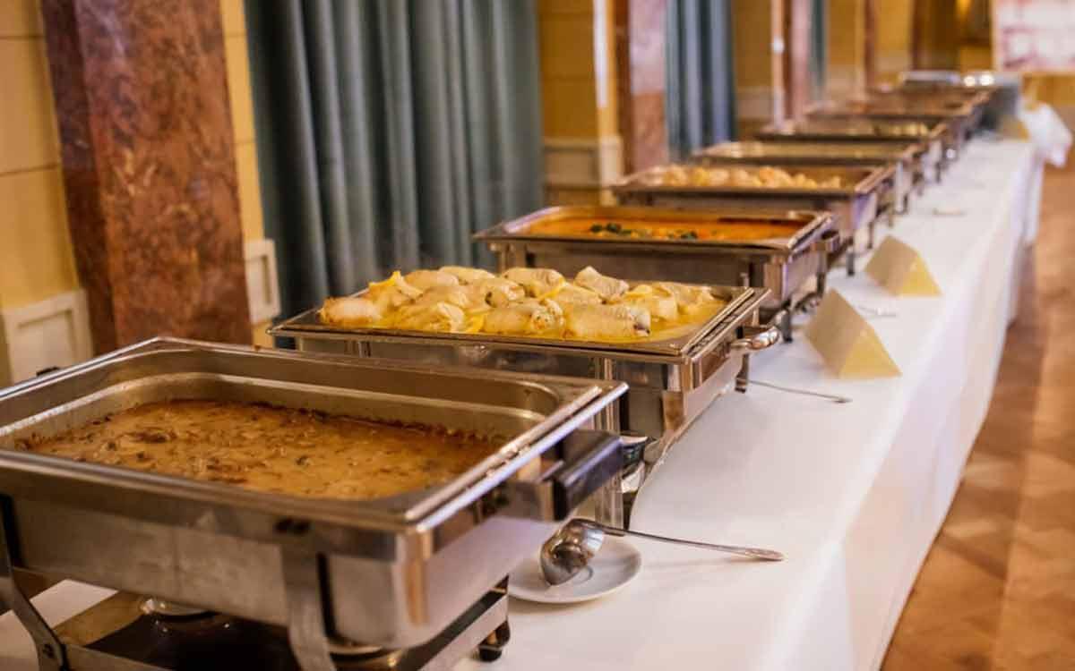 Professional buffet chafing dishes for rice ceremony catering in a Kolkata banquet hall — Annaprashan catering by Parsha Caterer